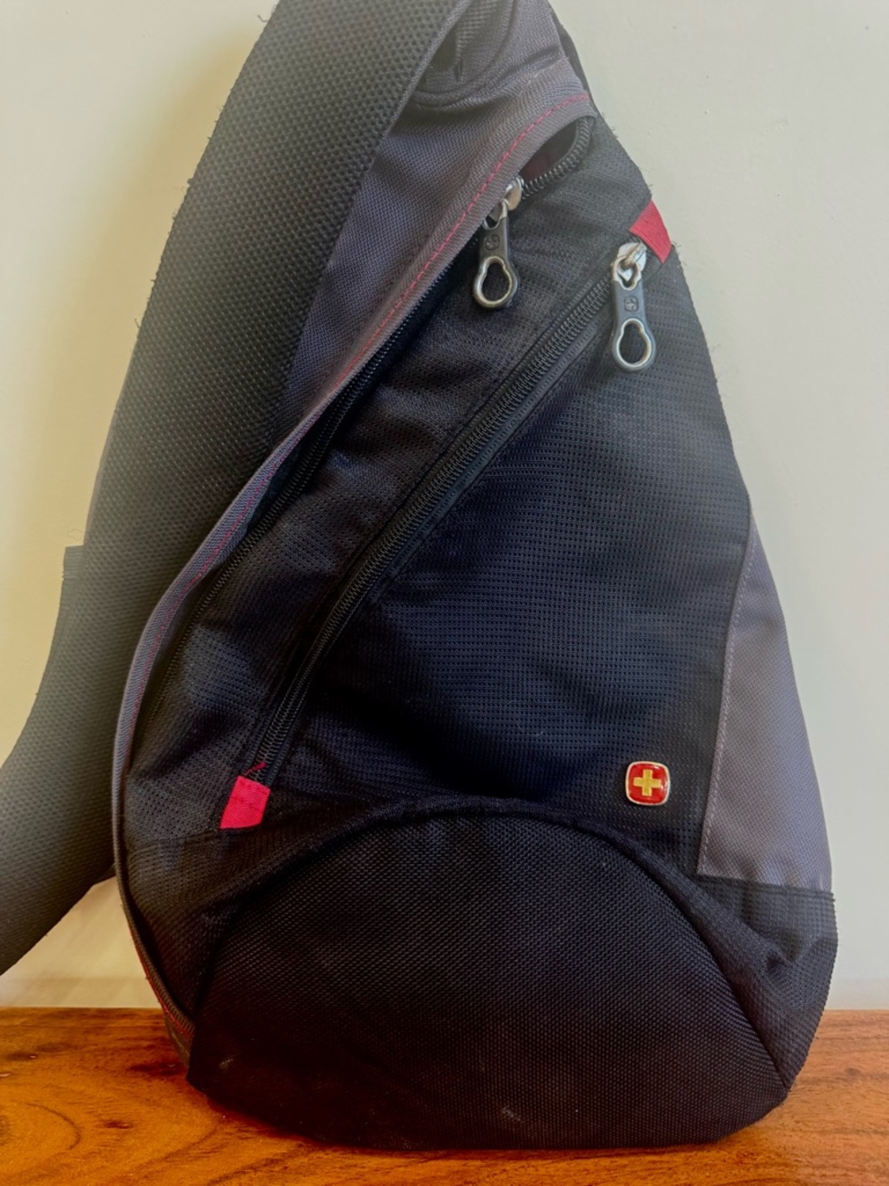 SwissGear Black Sling Bag with Red Accents